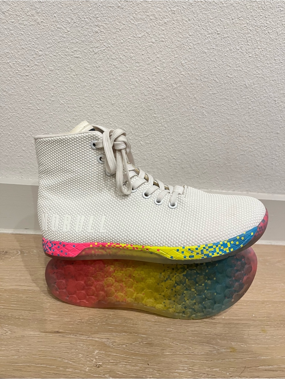 NOBULL White High-Top Sneaker with Pink and Yellow Pixel Sole neon glitch